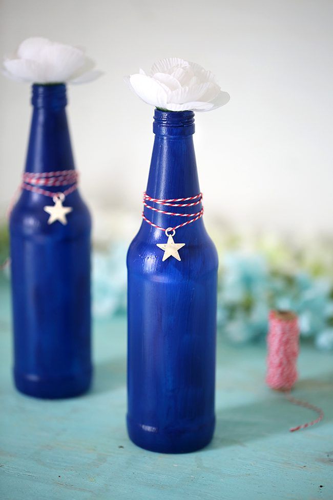 Make your own Red, White & Blue Glass Bottles with this DIY project.